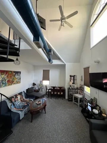 a living room with lots of furniture and a flat screen tv