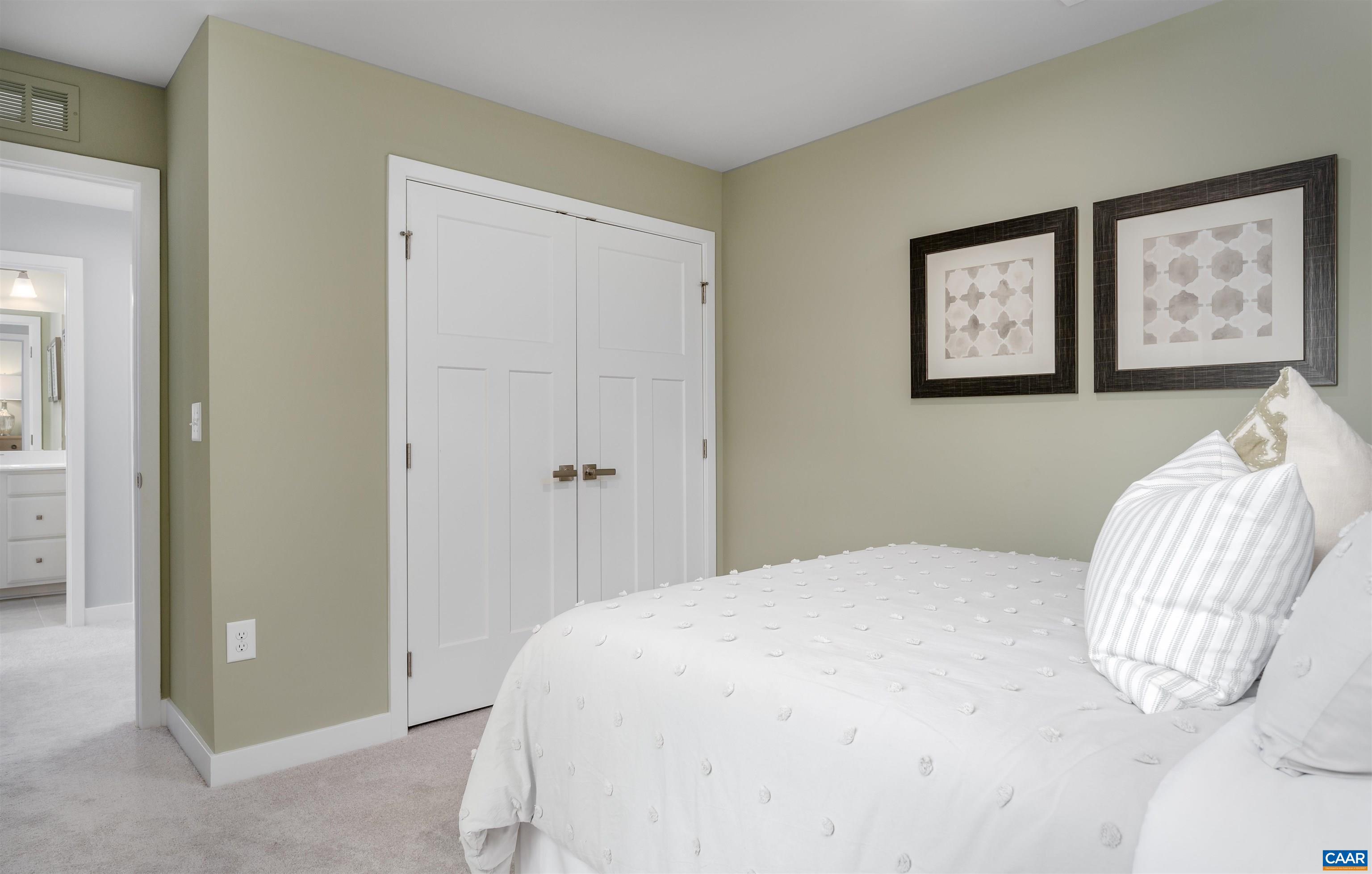 922 Marsac Street Charlottesville, VA 22901 - Photo 25 of 26 a bedroom with a bed and painting on the wall