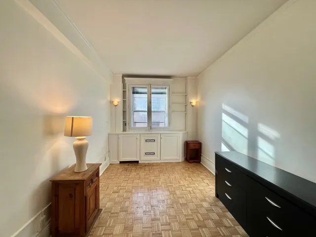 a view of workspace with furniture and window