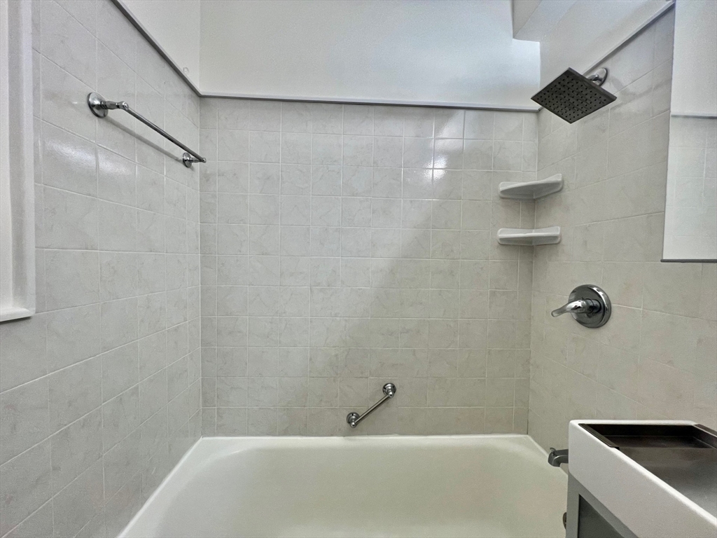 21 Beacon Street, Unit 6T Boston, MA 02108 - Photo 14 of 28 a bathroom with a shower and a bathtub