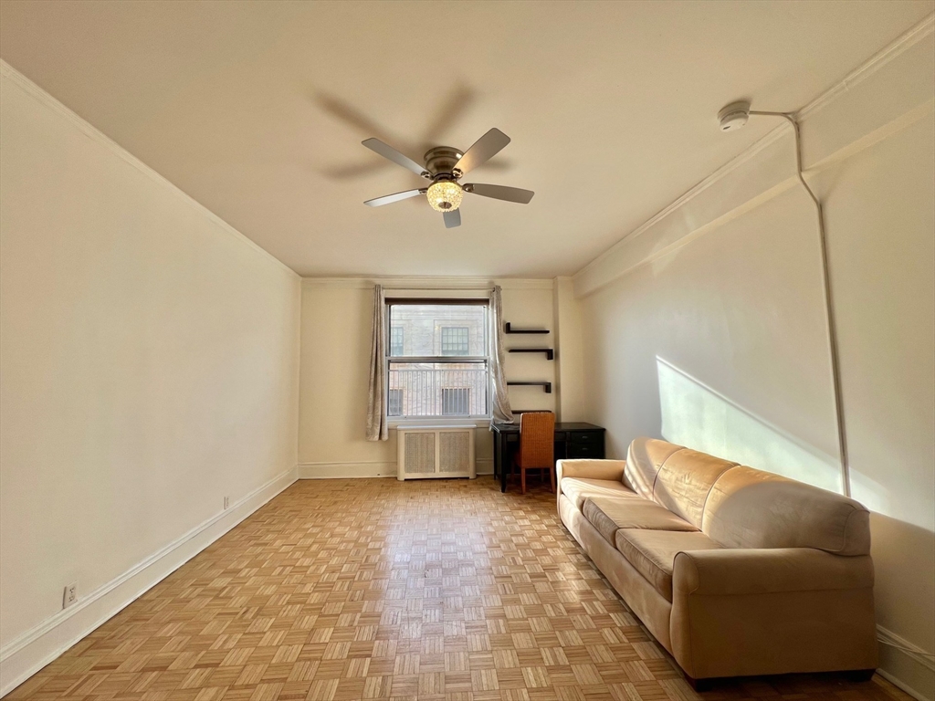 21 Beacon Street, Unit 6T Boston, MA 02108 - Photo 3 of 28 a living room with furniture and a ceiling fan