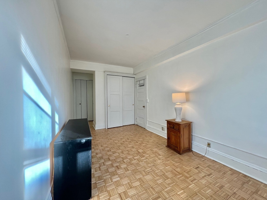 21 Beacon Street, Unit 6T Boston, MA 02108 - Photo 10 of 28 a view of empty room with wooden floor