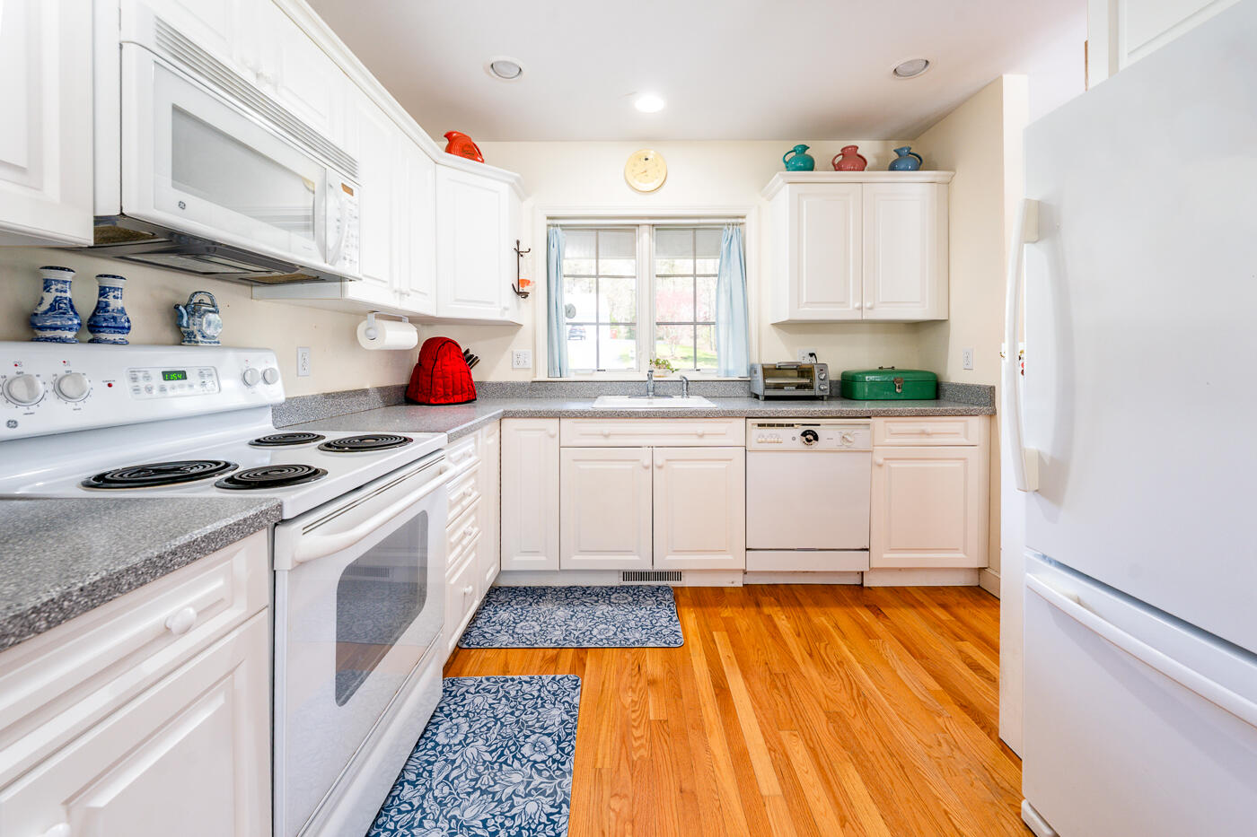 69 Regatta Drive Mashpee, MA 02649 - Photo 14 of 31 a kitchen with stainless steel appliances a stove a sink and a refrigerator