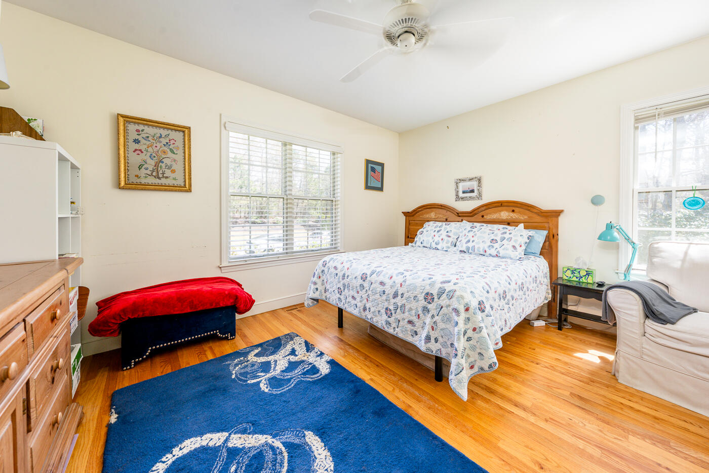 69 Regatta Drive Mashpee, MA 02649 - Photo 17 of 31 a bedroom with a bed and wooden floor