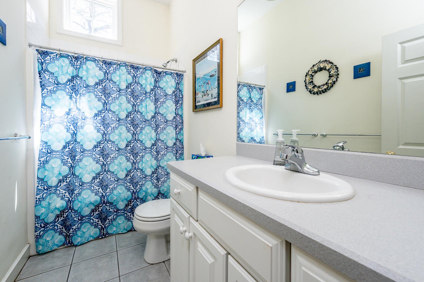 69 Regatta Drive Mashpee, MA 02649 - Photo 19 of 31 a bathroom with a toilet sink and mirror