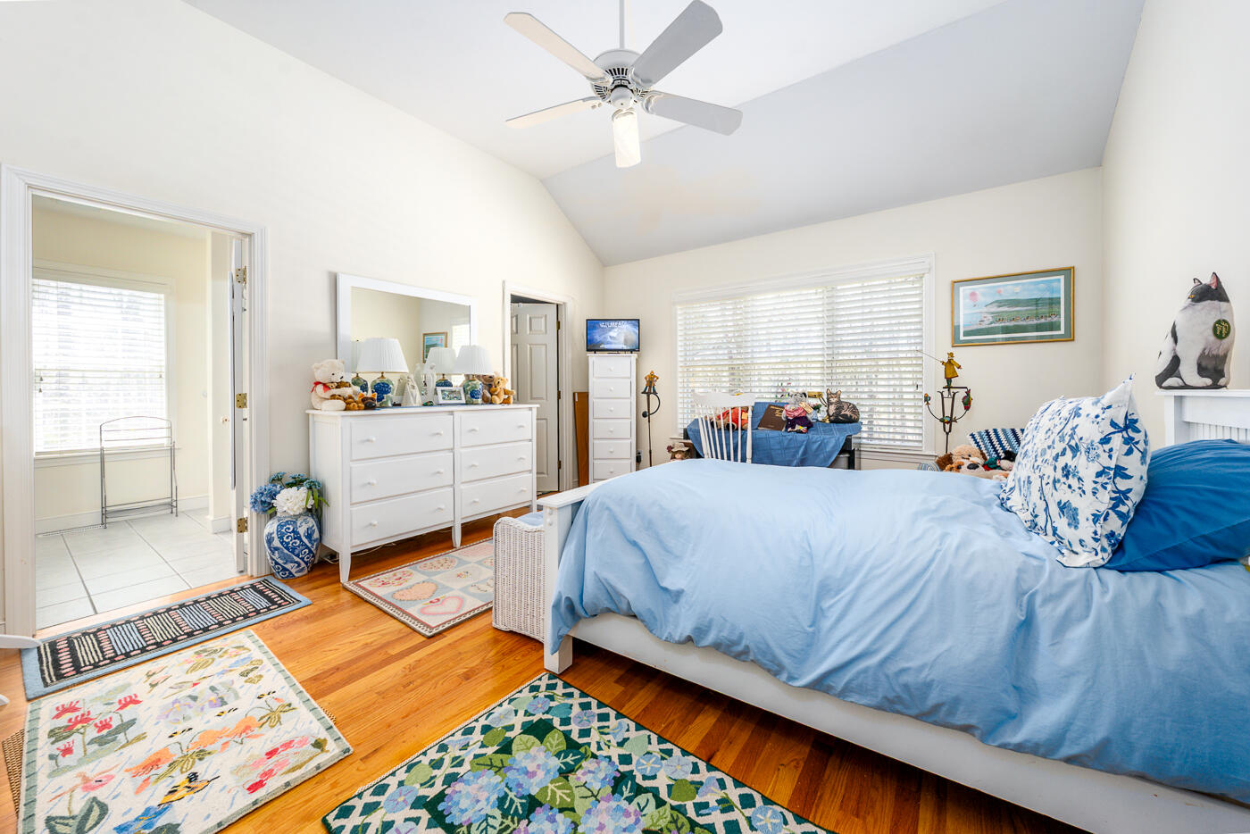 69 Regatta Drive Mashpee, MA 02649 - Photo 20 of 31 a bed room with a bed and a dresser