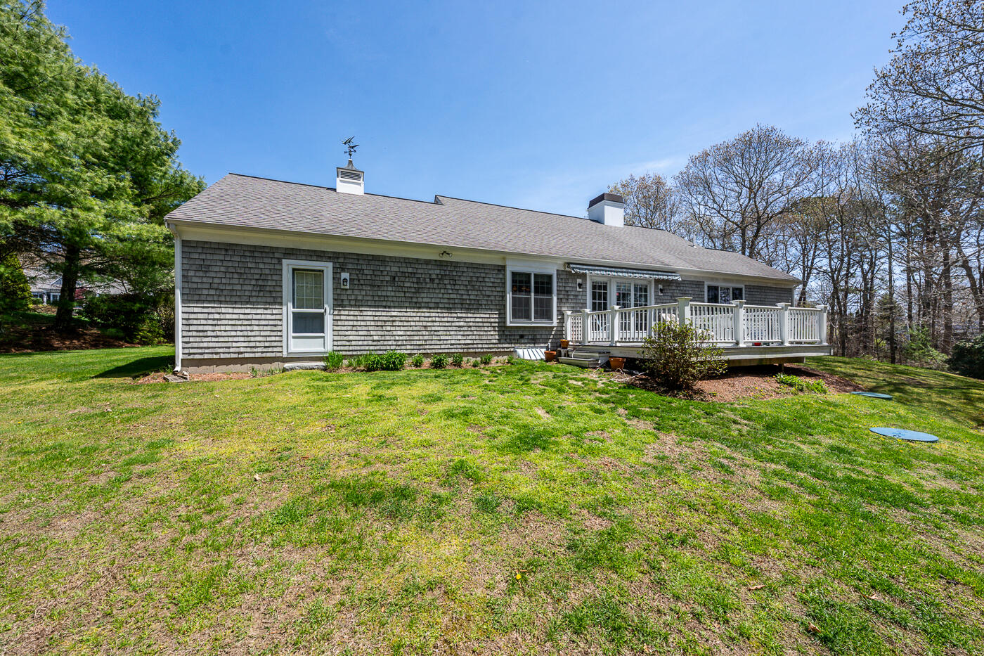 69 Regatta Drive Mashpee, MA 02649 - Photo 2 of 31 a front view of a house with a yard