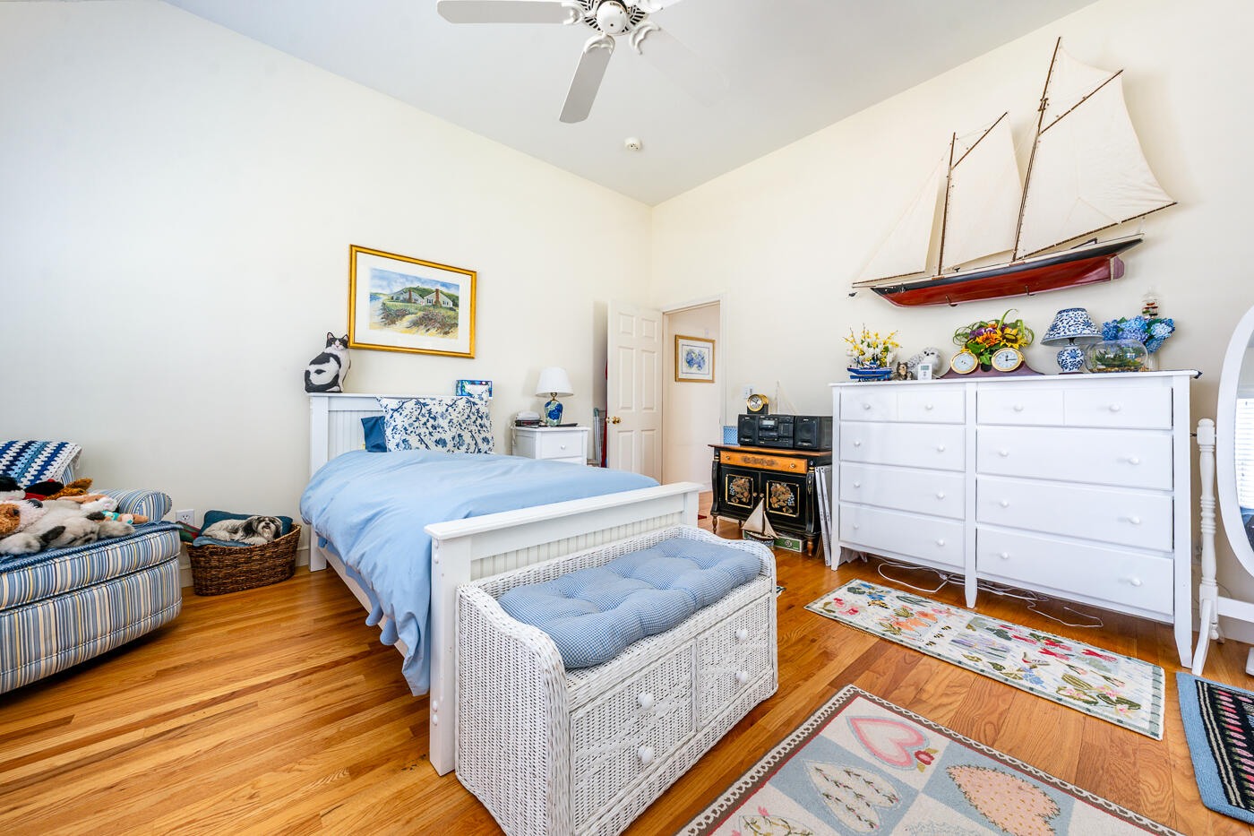 69 Regatta Drive Mashpee, MA 02649 - Photo 21 of 31 a bedroom with a bed and dresser