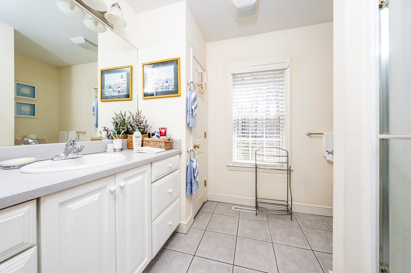 69 Regatta Drive Mashpee, MA 02649 - Photo 22 of 31 a bathroom with a sink a vanity and a mirror