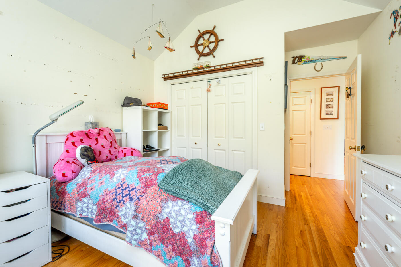 69 Regatta Drive Mashpee, MA 02649 - Photo 23 of 31 a bedroom with a bed and a dresser in it