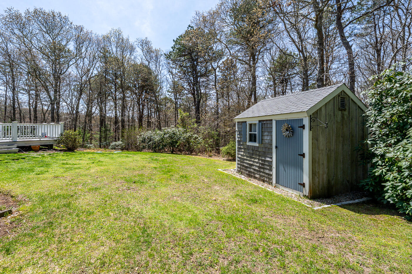 69 Regatta Drive Mashpee, MA 02649 - Photo 25 of 31 a view of house with outdoor space and garden