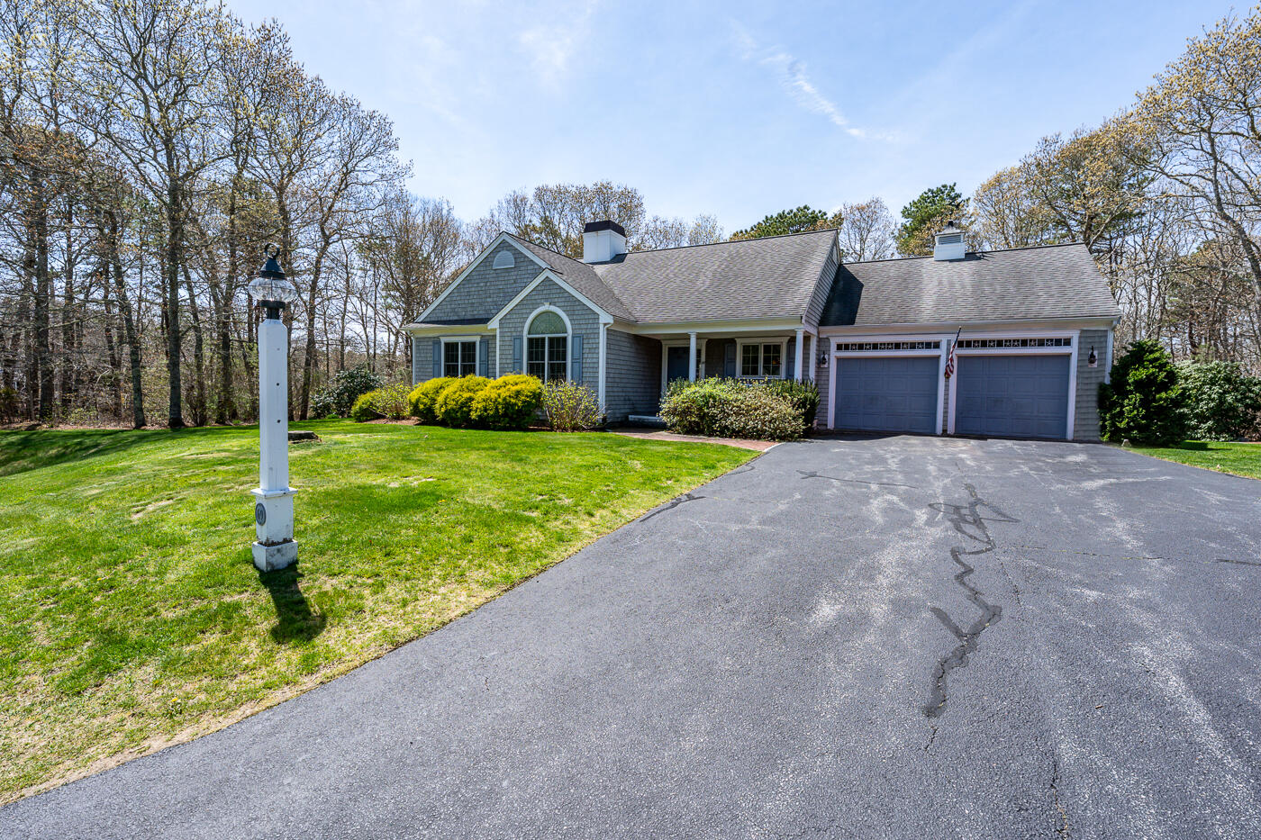 69 Regatta Drive Mashpee, MA 02649 - Photo 5 of 31 a view of a house with a yard and large tree