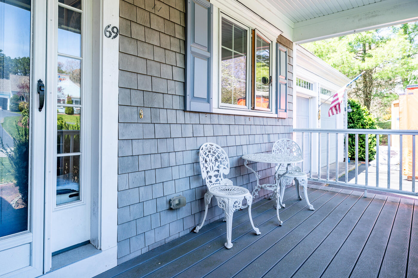 69 Regatta Drive Mashpee, MA 02649 - Photo 6 of 31 a view of a chair and table in the balcony