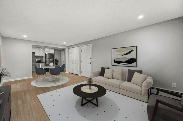 64 Goldthwaite Road, Unit 10 Worcester, MA 01605 - Photo 2 of 13 a living room with furniture and a wooden floor