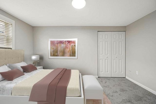 64 Goldthwaite Road, Unit 10 Worcester, MA 01605 - Photo 6 of 13 a bedroom with a bed and a window