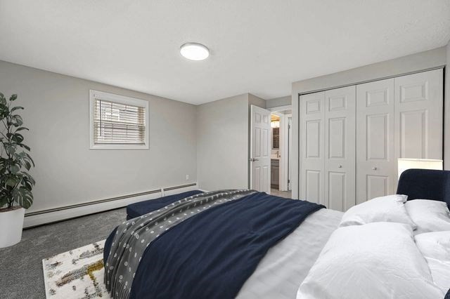 64 Goldthwaite Road, Unit 10 Worcester, MA 01605 - Photo 7 of 13 a bedroom with a bed and a window