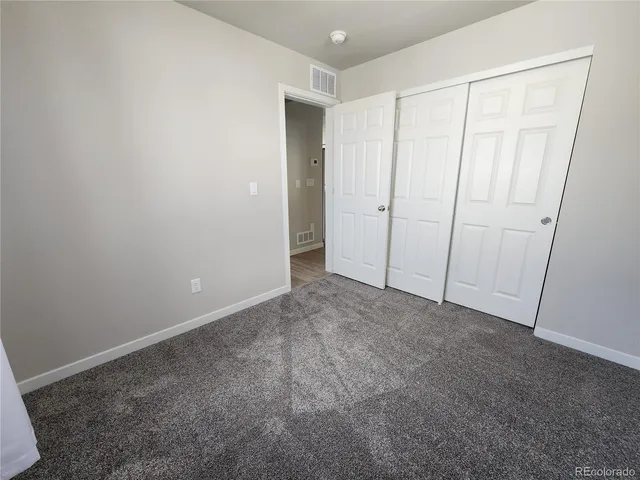 a view of an empty room and entryway