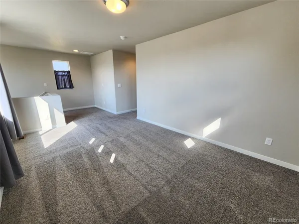 a view of an empty room and window