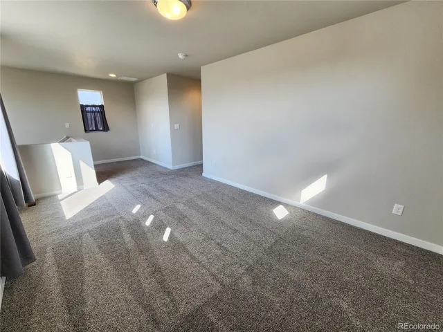 a view of an empty room and window