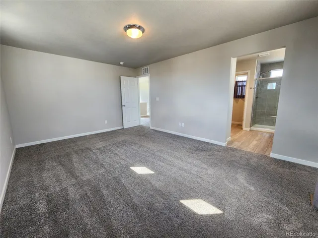 a bathroom with a granite countertop sink mirror and shower