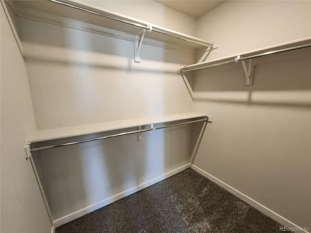 a front view of a house with parking space