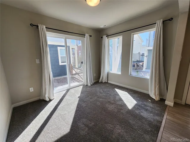 a view of a room with a large window