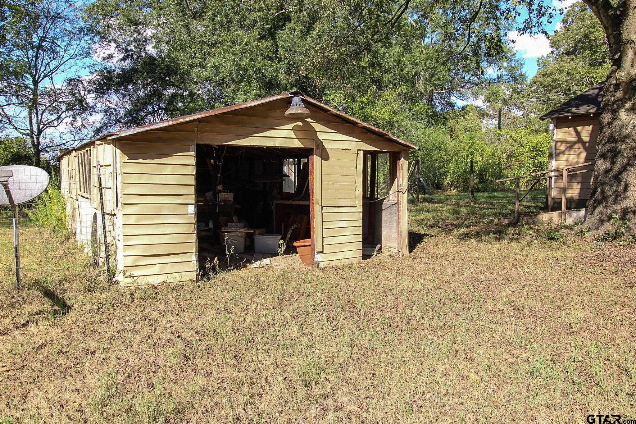 407 Pace Street Naples, TX 75568 - Photo 29 of 31 a view of a house with a yard