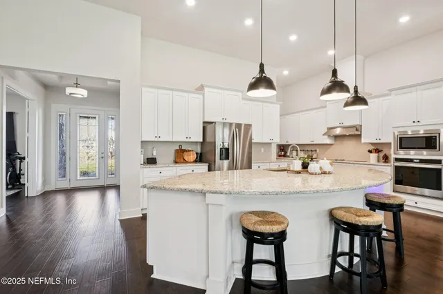 a kitchen with granite countertop white cabinets and a granite counter tops