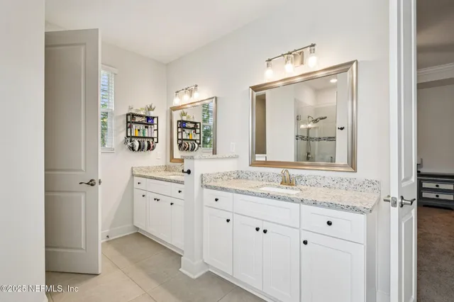 a bedroom with bed and book shelf