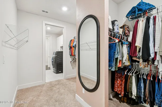 a living room with furniture and windows