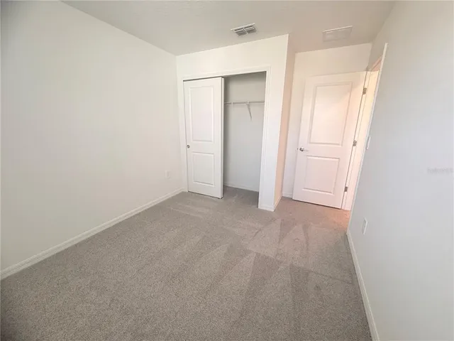 a view of a glass door and a window