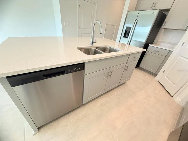 a kitchen with a sink and cabinets