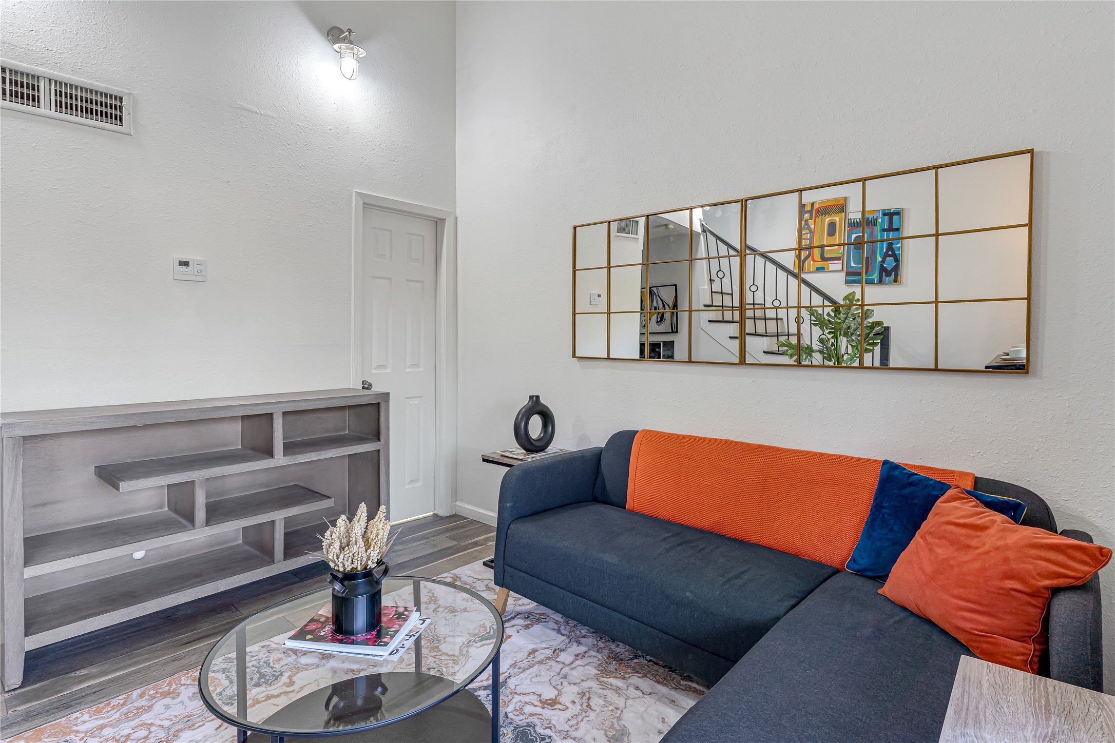 12900 Walden Road, Unit 502E Montgomery, TX 77356 - Photo 12 of 31 a blue room with a couch and a table