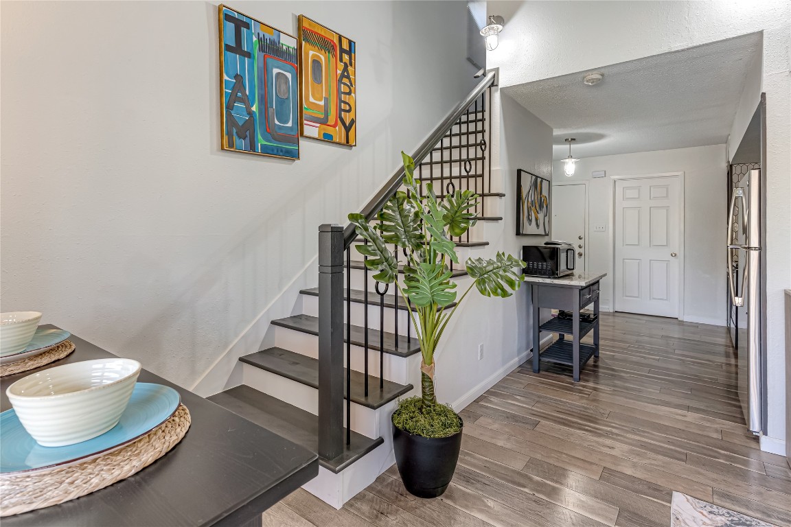 12900 Walden Road, Unit 502E Montgomery, TX 77356 - Photo 14 of 31 a dining room with furniture and wooden floor