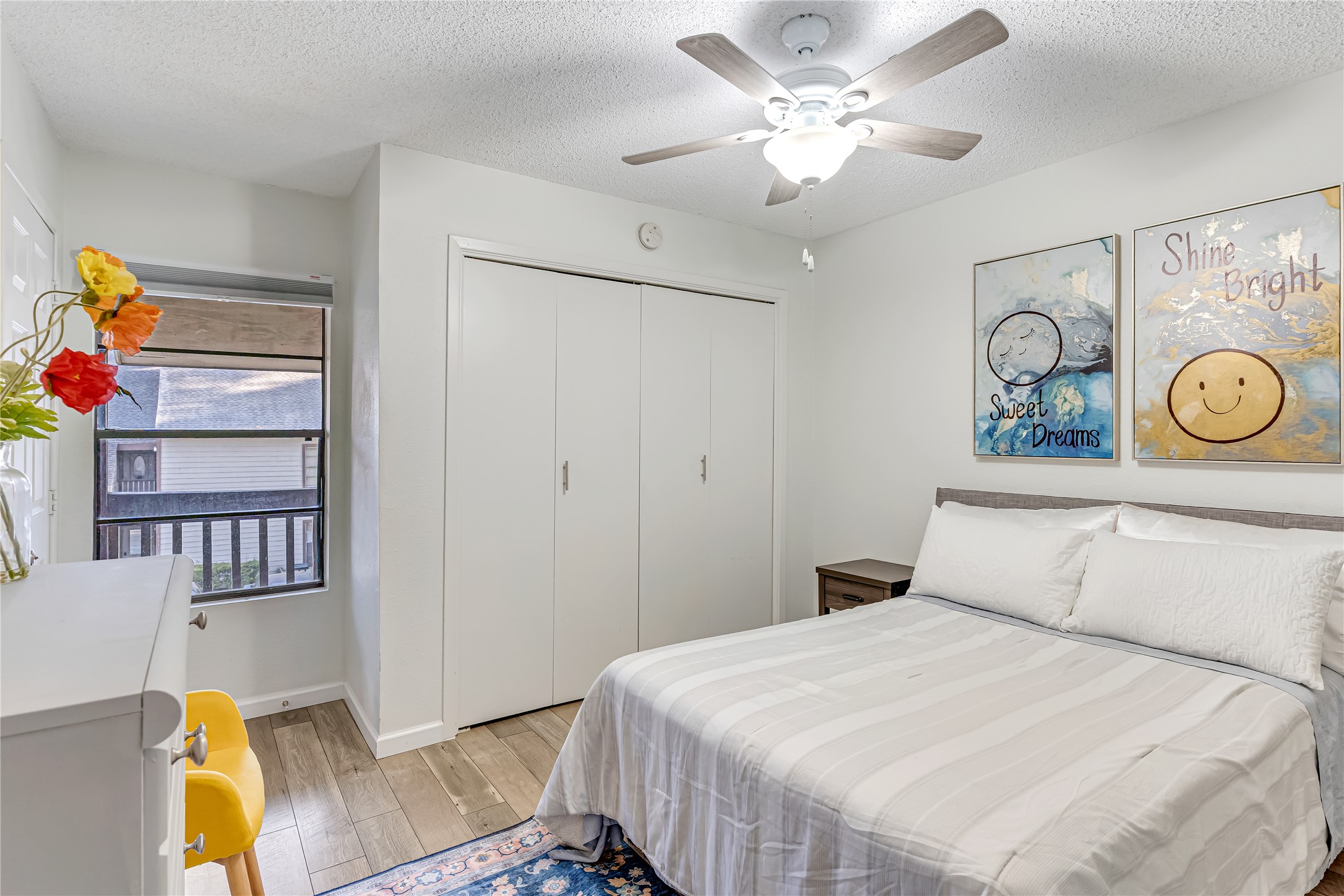 12900 Walden Road, Unit 502E Montgomery, TX 77356 - Photo 17 of 31 a bedroom with a bed and a chandelier