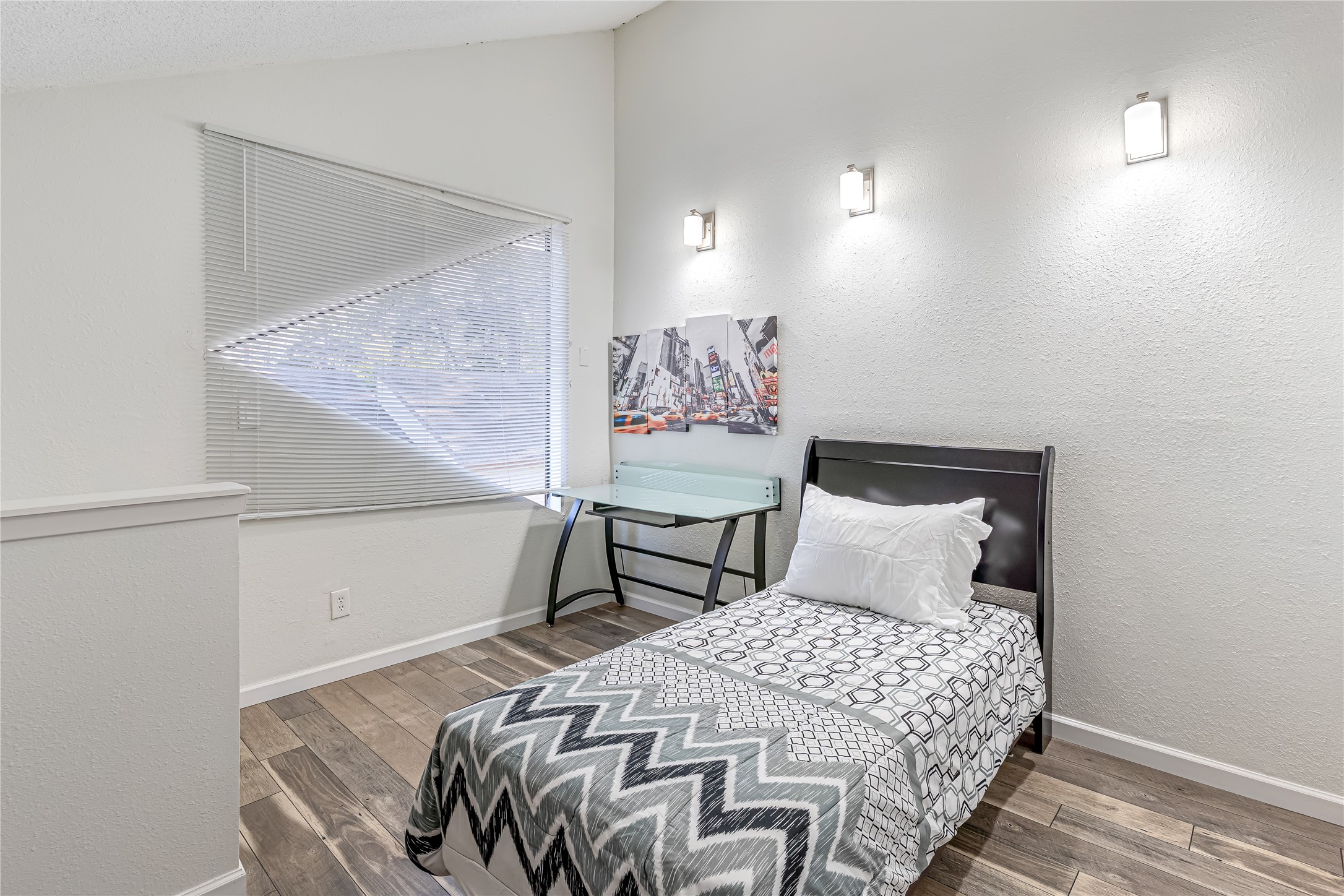 12900 Walden Road, Unit 502E Montgomery, TX 77356 - Photo 20 of 31 a bedroom with a bed and a painting on the wall