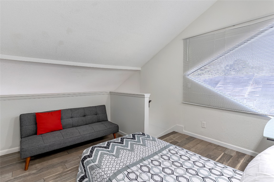 12900 Walden Road, Unit 502E Montgomery, TX 77356 - Photo 21 of 31 a living room with furniture and a rug