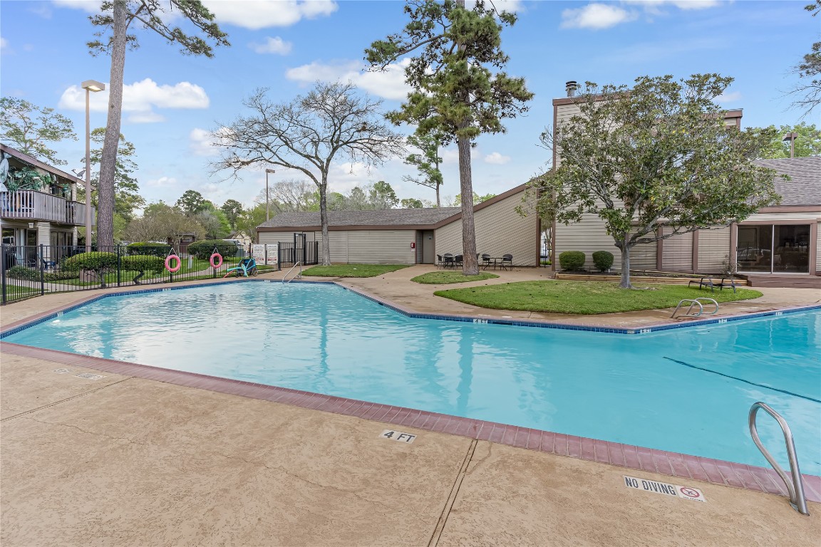 12900 Walden Road, Unit 502E Montgomery, TX 77356 - Photo 26 of 31 a view of a swimming pool with an outdoor space