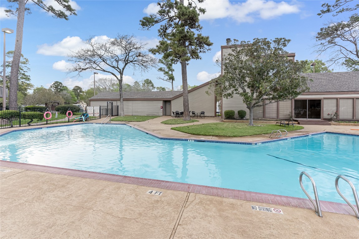 12900 Walden Road, Unit 502E Montgomery, TX 77356 - Photo 27 of 31 a view of a backyard with swimming pool