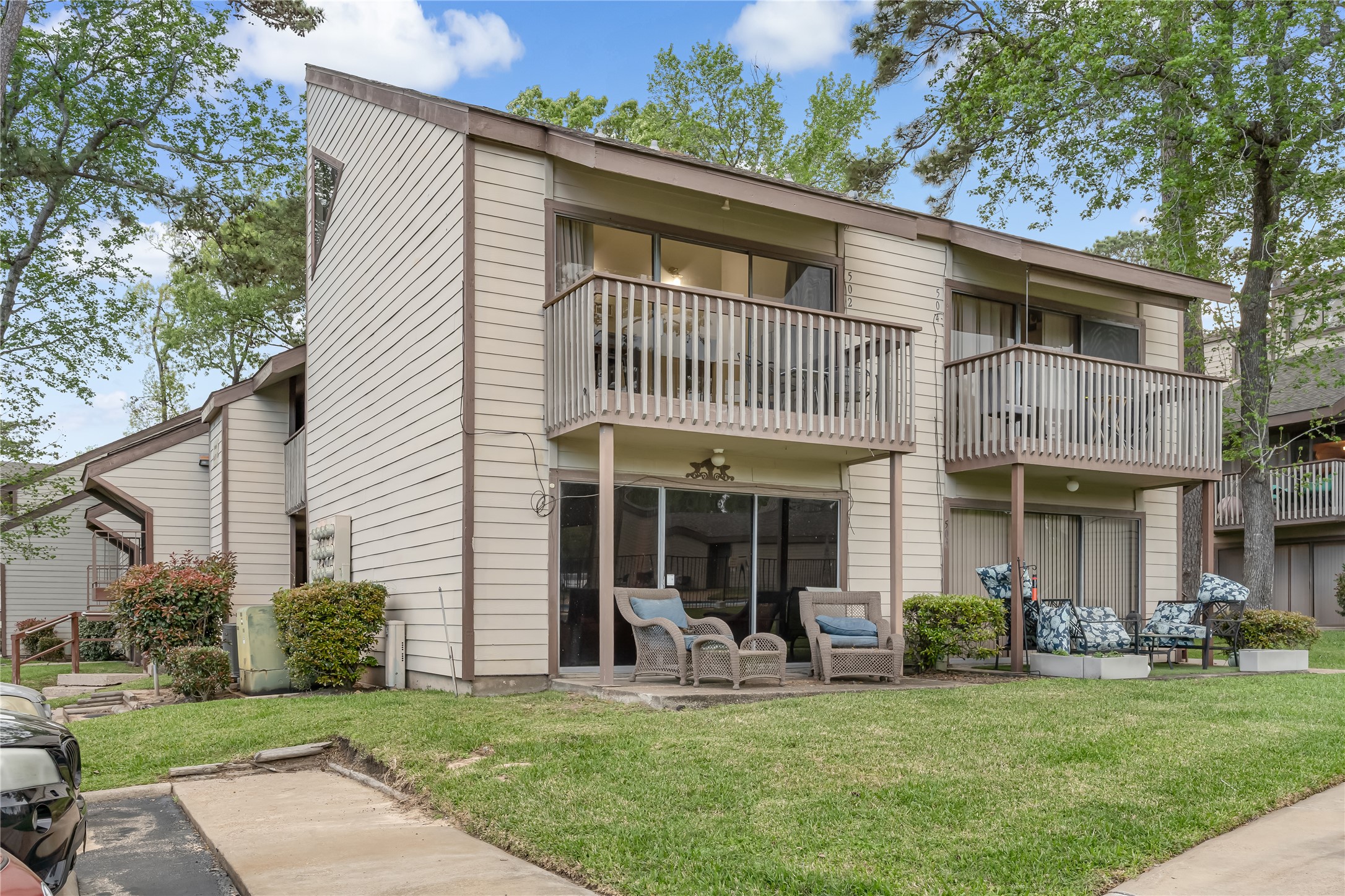 12900 Walden Road, Unit 502E Montgomery, TX 77356 - Photo 3 of 31 a view of a house with a yard