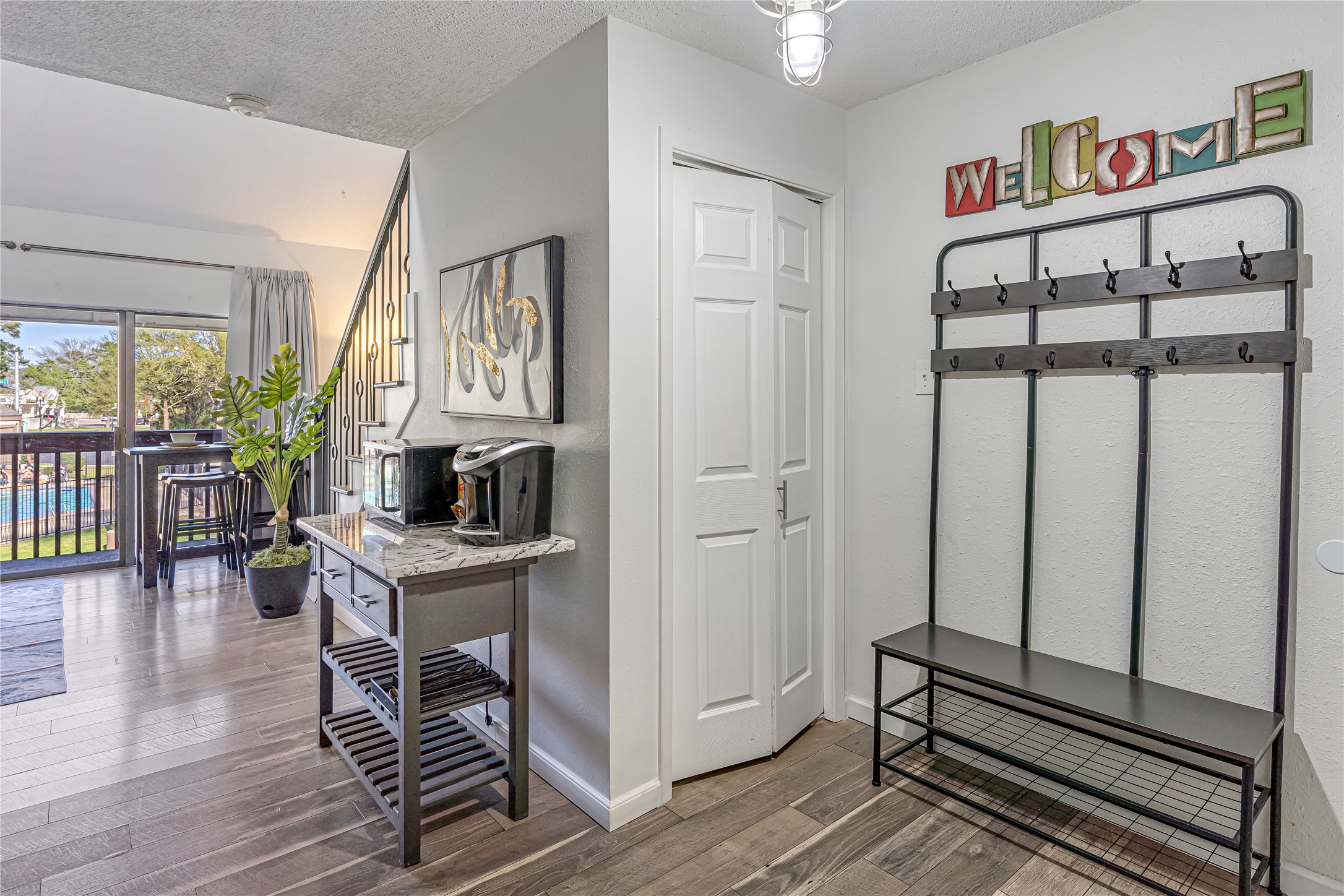12900 Walden Road, Unit 502E Montgomery, TX 77356 - Photo 6 of 31 a view of a livingroom with furniture wooden floor and front door
