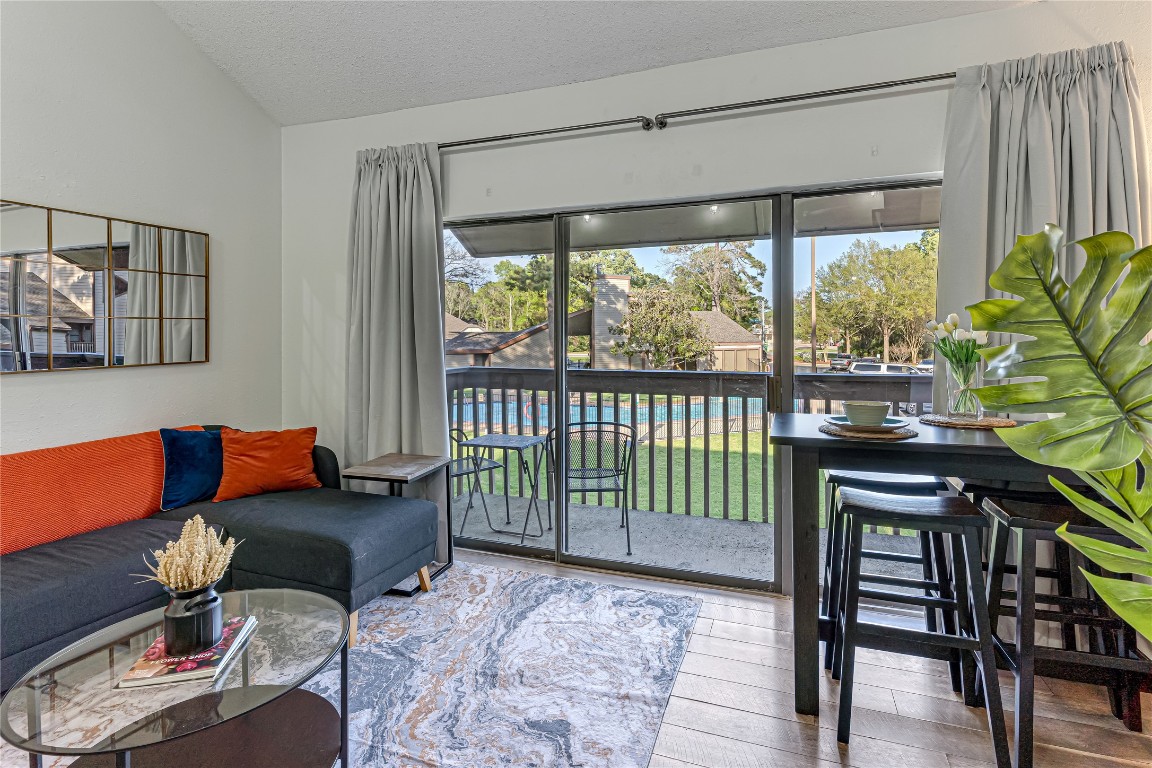 12900 Walden Road, Unit 502E Montgomery, TX 77356 - Photo 7 of 31 a living room with furniture and a window