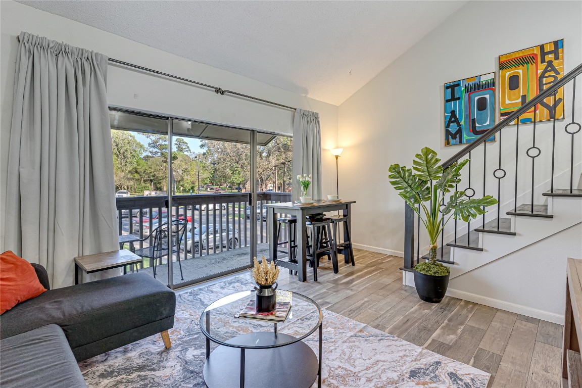 12900 Walden Road, Unit 502E Montgomery, TX 77356 - Photo 8 of 31 a living room with furniture and a potted plant