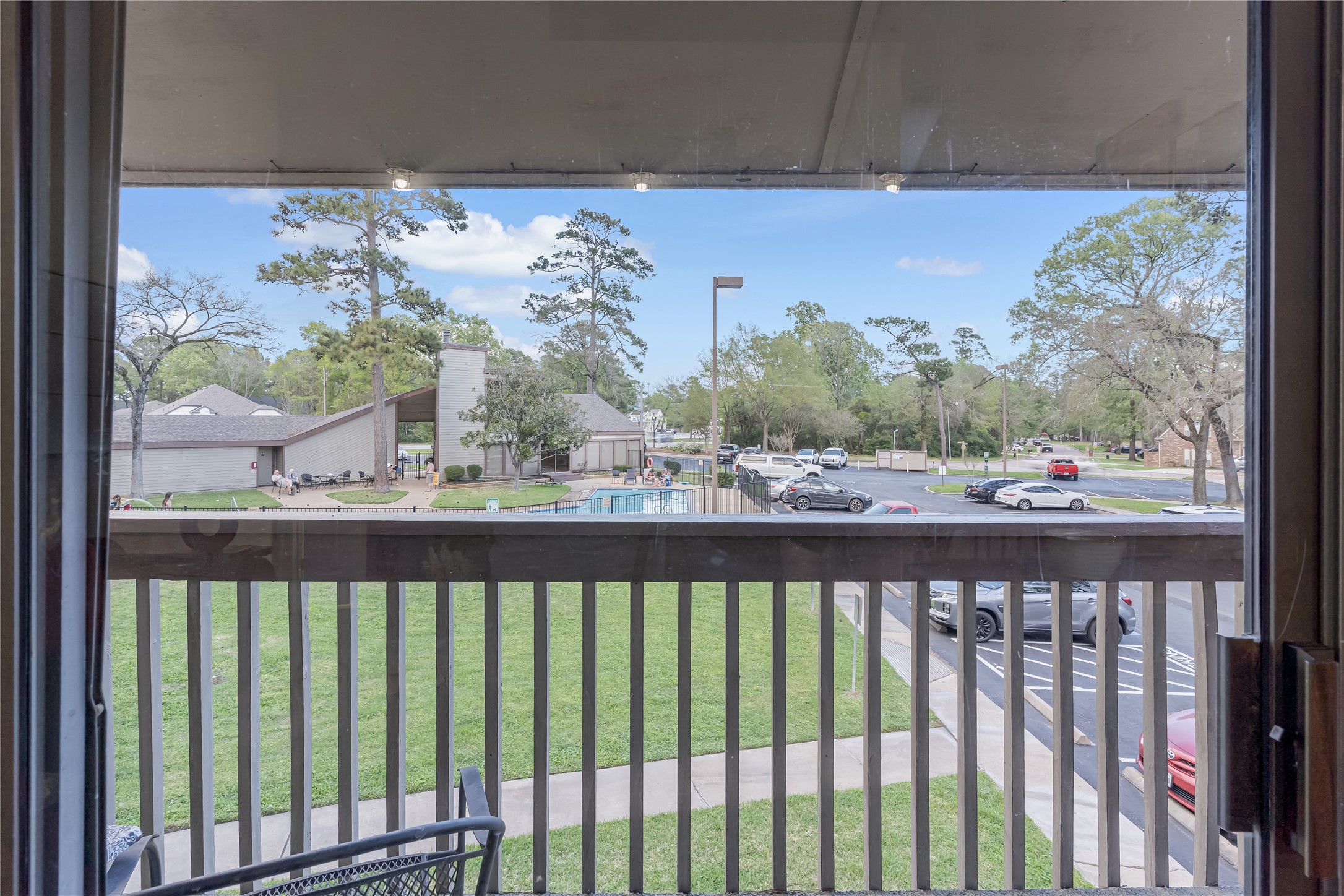 12900 Walden Road, Unit 502E Montgomery, TX 77356 - Photo 9 of 31 a view of a balcony with wooden floor