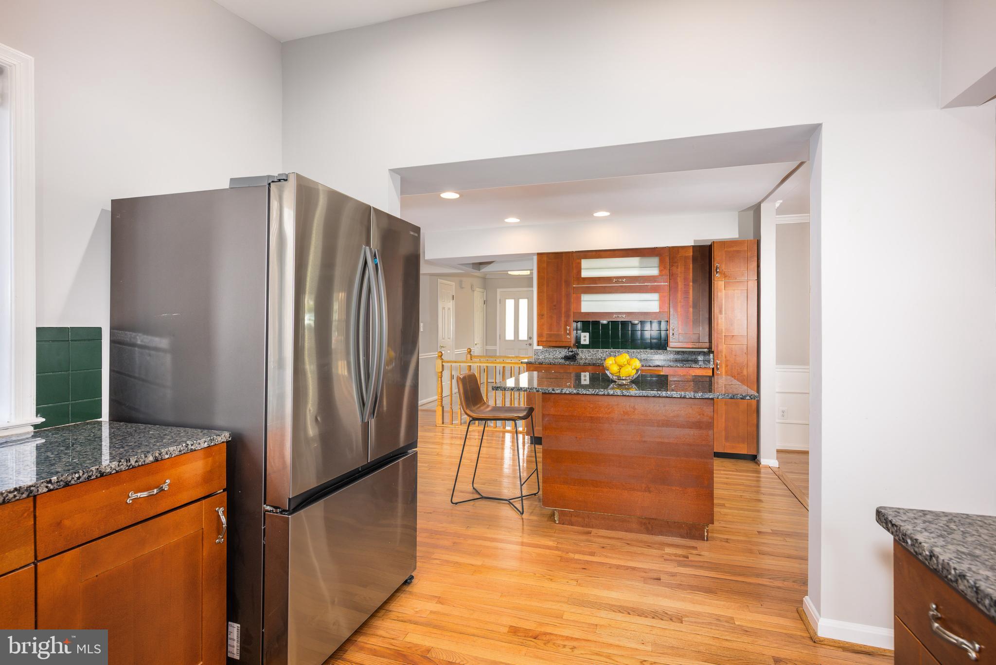 2212 Blue Valley Drive Silver Spring, MD 20904 - Photo 17 of 61 a kitchen with stainless steel appliances a refrigerator and a stove top oven