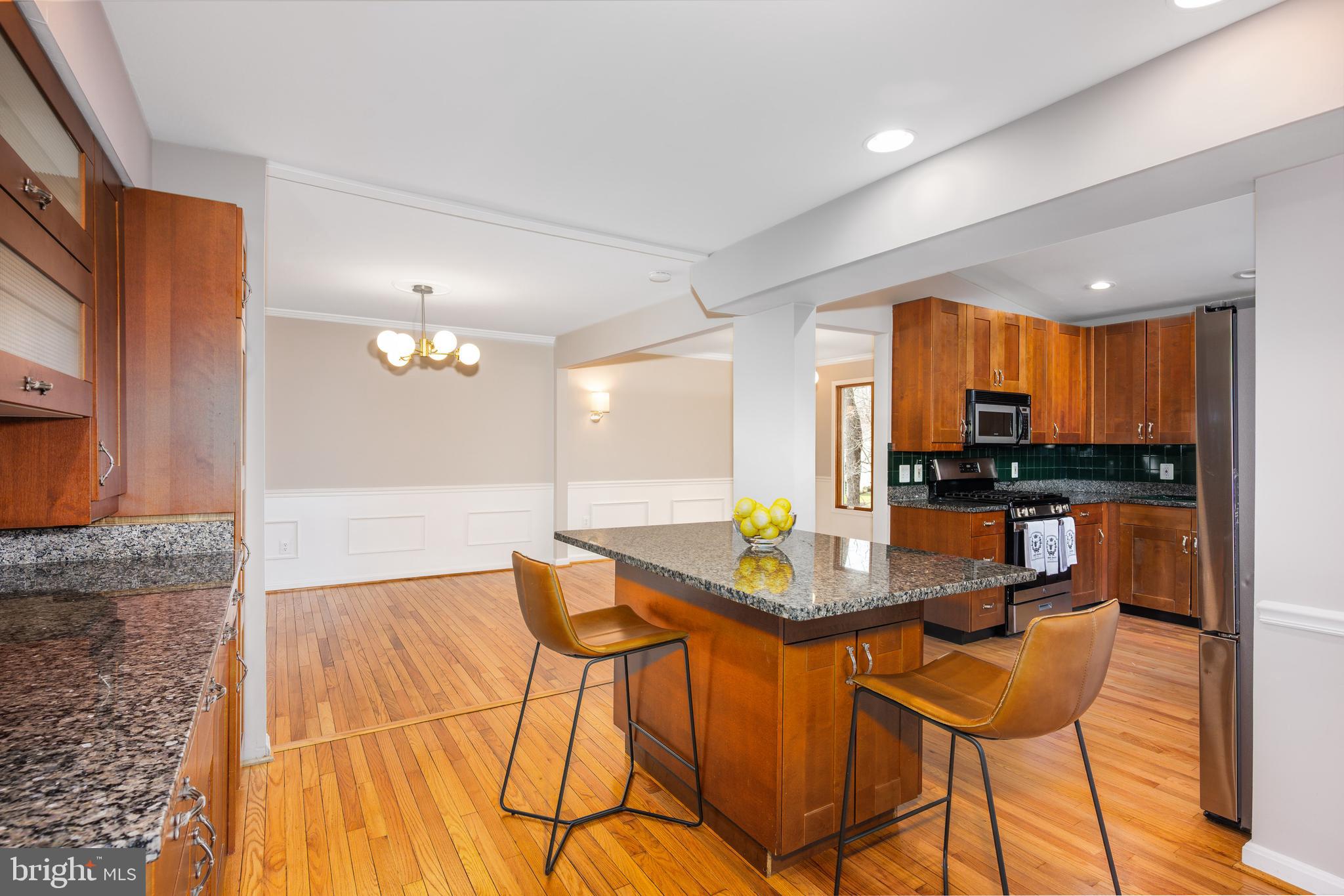 2212 Blue Valley Drive Silver Spring, MD 20904 - Photo 21 of 61 a view of a dining room with furniture and wooden floor