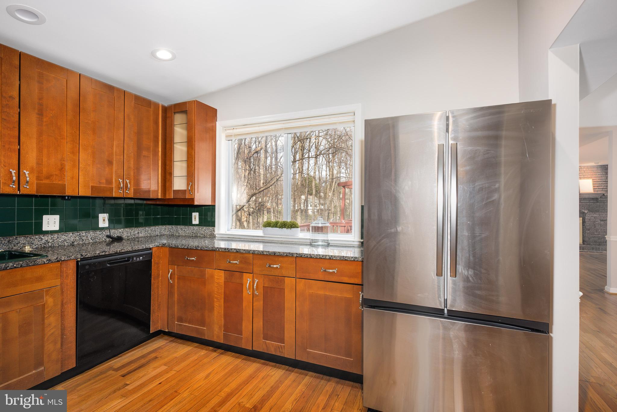 2212 Blue Valley Drive Silver Spring, MD 20904 - Photo 22 of 61 a kitchen with stainless steel appliances granite countertop a refrigerator a sink and dishwasher with wooden floor