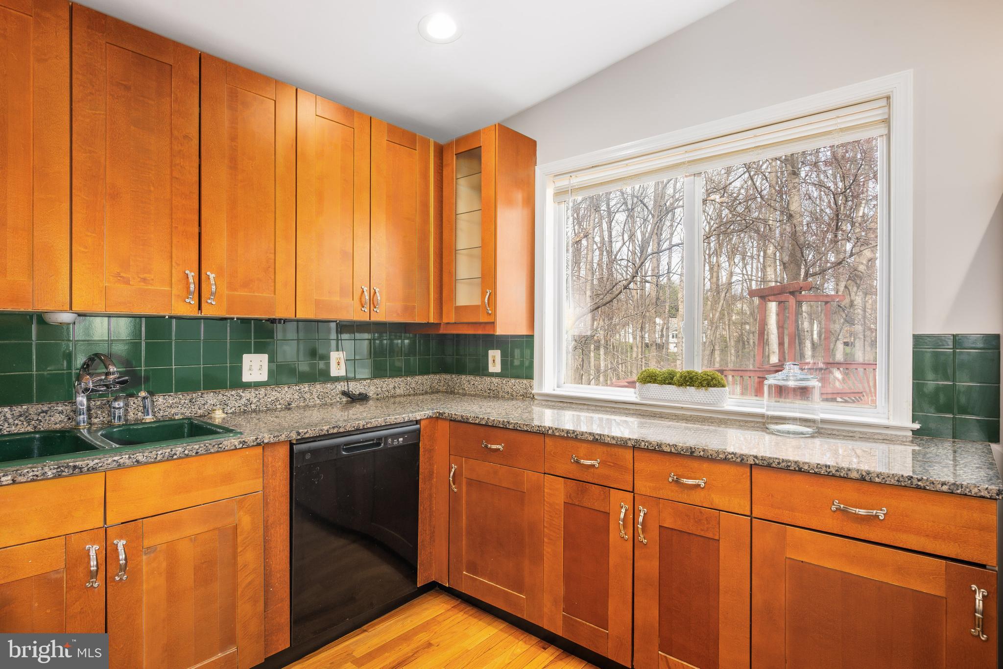 2212 Blue Valley Drive Silver Spring, MD 20904 - Photo 23 of 61 a kitchen with stainless steel appliances granite countertop sink stove and cabinets