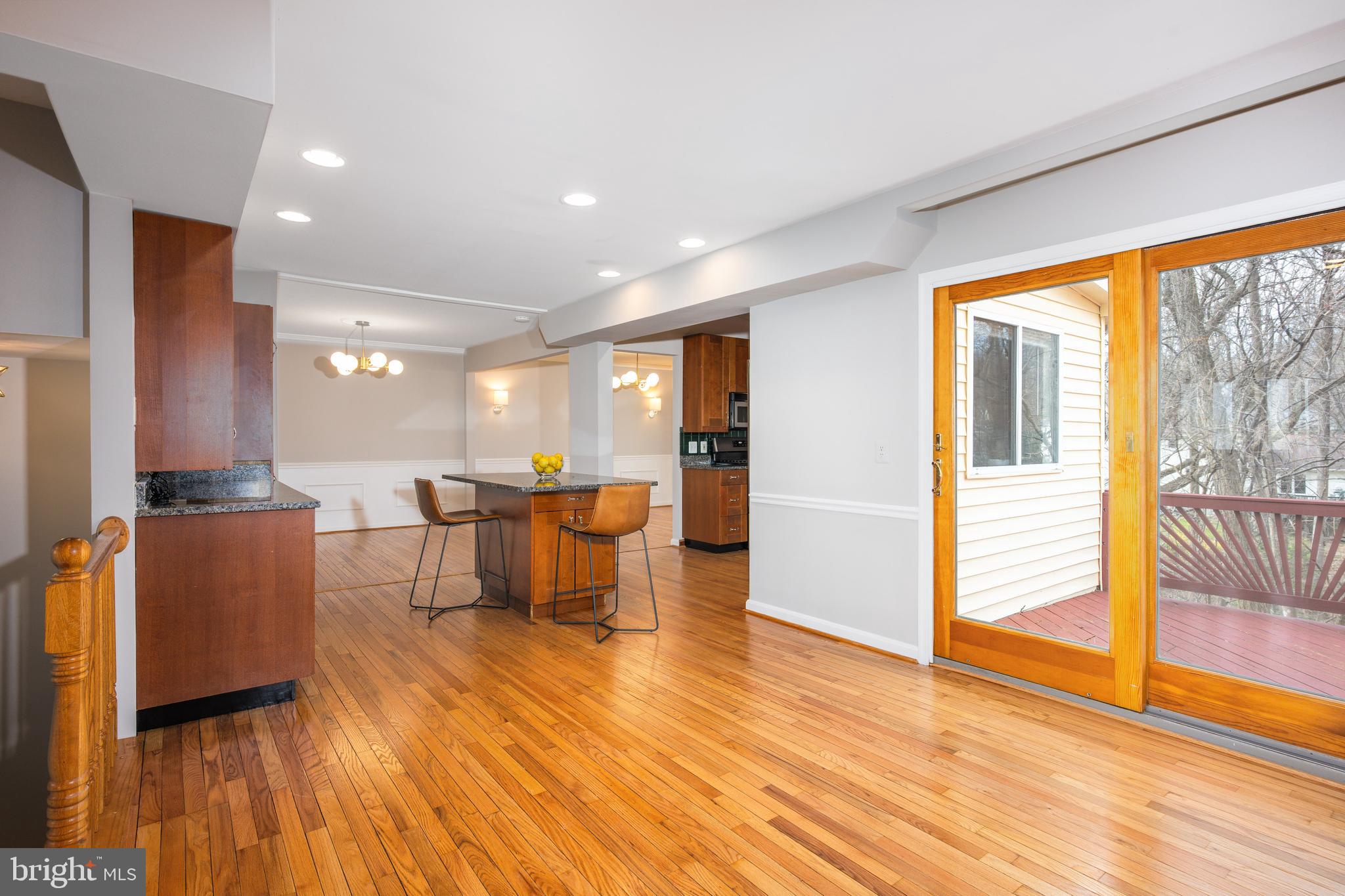2212 Blue Valley Drive Silver Spring, MD 20904 - Photo 25 of 61 a living room with furniture a large window and wooden floor
