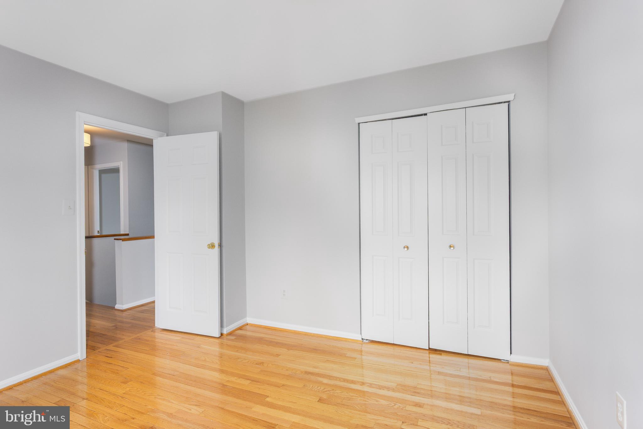 2212 Blue Valley Drive Silver Spring, MD 20904 - Photo 32 of 61 a view of an empty room and wooden floor
